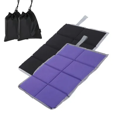 Two folded seat cushions, one purple and one black, are shown on a white background. Two black drawstring bags are also visible in the upper left corner.