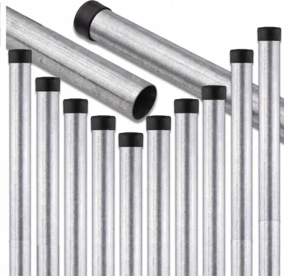 A collection of galvanized metal posts with black caps, arranged in a diagonal and vertical formation against a white background.