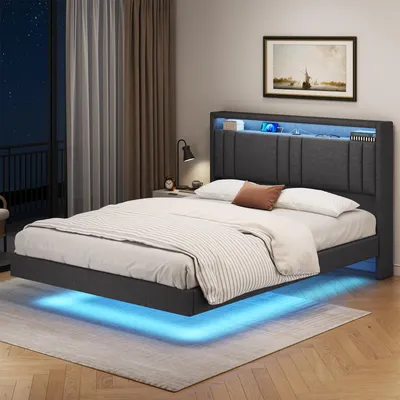 A bedroom scene at night with a bed featuring LED lighting.