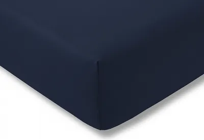 A close-up view of a navy blue fitted sheet, showing the corner and the texture of the fabric.