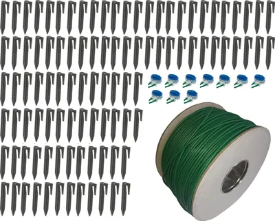 A collection of garden stakes, wire connectors, and a spool of green wire.