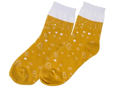A pair of socks designed to look like beer with foam.