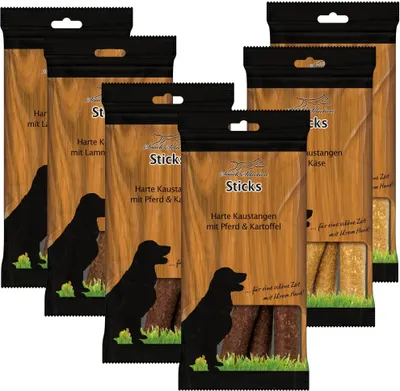 Several packages of dog treats arranged in a group.