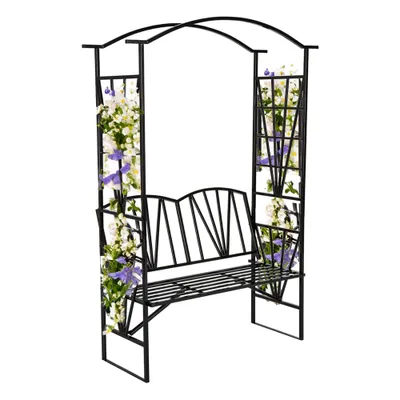 A black metal garden bench with a pergola arch, decorated with artificial white and purple flowers.