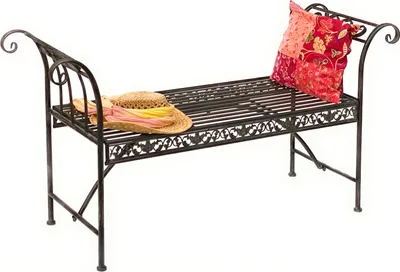 A metal garden bench with a straw hat and a decorative pillow on it, set against a white background.