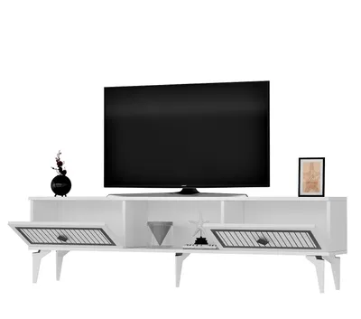 A white TV stand with a black TV on top, and decorative items on the stand.