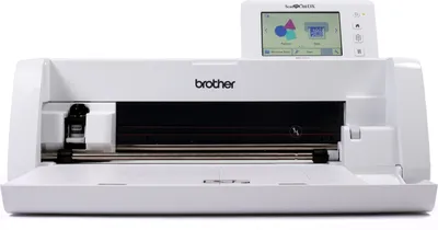 A white Brother ScanNCut SDX1550 cutting machine is shown from the front with its lid open.