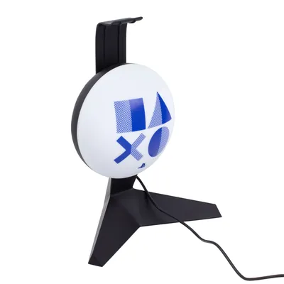 A black headset stand with a white circular light featuring the Playstation logo.