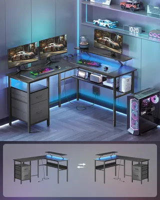 A gaming desk setup with multiple monitors, LED lighting, and accessories.