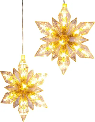 Two illuminated snowflake-shaped lights hanging against a white background.