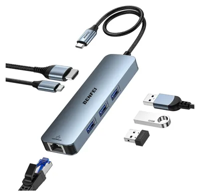 A collection of USB-C hub accessories, including the hub itself, cables, and flash drives, arranged on a white background.