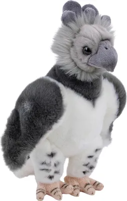 A plush toy of a harpy eagle is shown from a side-diagonal view against a white background.