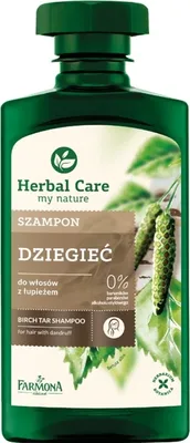 A bottle of shampoo with branding and product information.