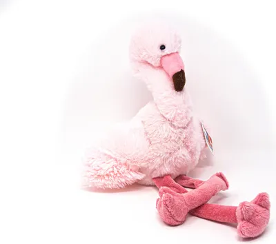 A pink plush flamingo toy is sitting on a white background.