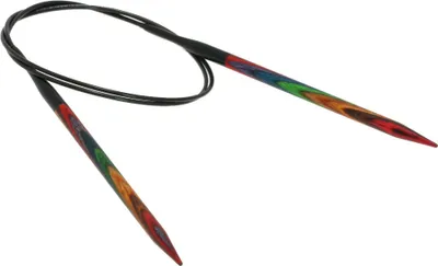 A pair of circular knitting needles with a black cable and multicolor wooden tips, laid out on a white background.