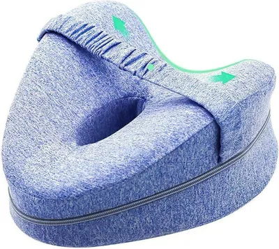 A blue, contoured pillow with a cutout in the center, designed to be placed between the legs.