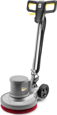 A floor cleaning machine with a rotating brush.