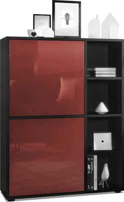 A modern highboard cabinet with red high-gloss doors and black matte frame, displayed in a studio setting with decorative items on top.