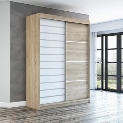 A modern sliding door wardrobe in a room with a concrete wall and wooden floor.