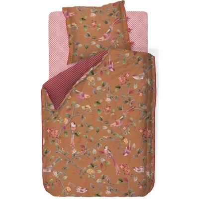 A flat lay of bedding with a floral and bird pattern.
