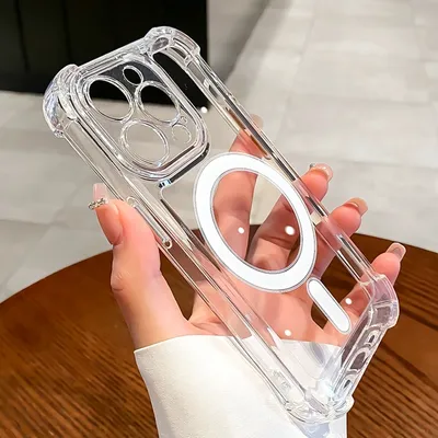 A hand holding a clear iPhone case with a MagSafe ring.