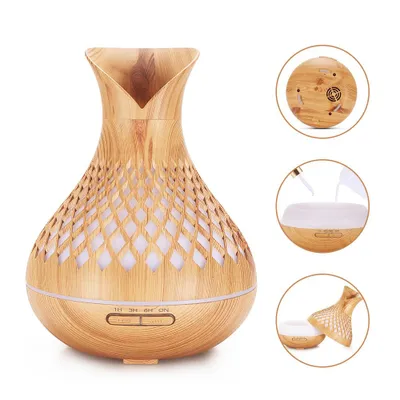 A wooden-patterned aroma diffuser with LED lights.