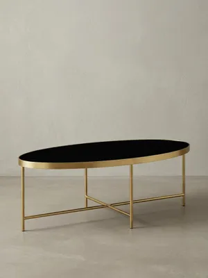 Produktbild von "Vils" Couchtisch, oval, Glasplatte, filigranes Metallgestell, Schwarz/Gold. 110x56x40 cm | Kadima Design