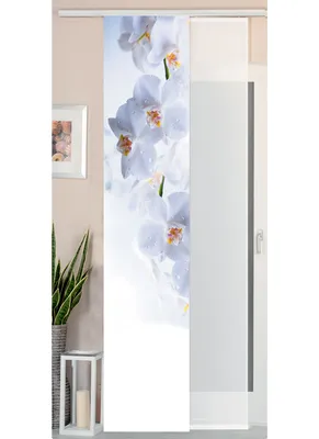 A sliding curtain with a white orchid pattern is displayed in a room.