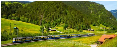 Produktbild von Wallario Wandbild aus Acryl, 200 x 80 cm, freischwebende Optik - Eisenbahn in einer Sommerlandschaft in der Schweiz