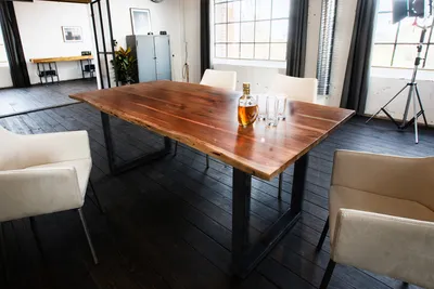 Produktbild von KAWOLA Esstisch LORE 200x100cm massiv mit Baumkante Nussbaumfarben Fuß schwarz