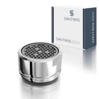 A chrome aerator and its packaging are displayed on a white reflective surface.