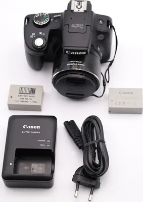 Image de Appareil photo bridge Full HD Canon Powershot SX50 HS 12,1 mégapixels, zoom optique 50x/zoom numérique 200x, distance focale 24-1200 mm, stabilisateur d'image optique, capteur CMOS 1/2,3 pouces, F3,4 (W) - F6,5 (T), écran 2,8 pouces (7,11 cm), détection des visages et des sourires