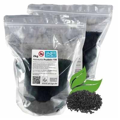 Two sealed plastic bags filled with activated carbon granules, with a label on the front bag and a pile of granules in the foreground.