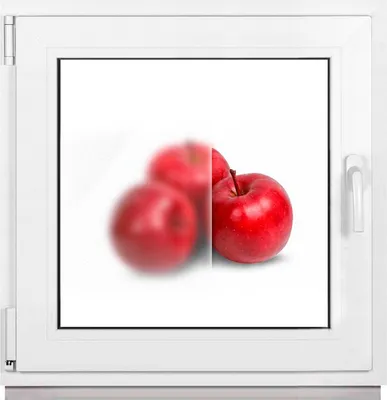 A window frame with a frosted glass pane showing a blurred image of apples on the left and a clear image of an apple on the right.