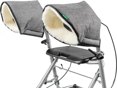 A close-up view of a rollator with hand warmers attached.