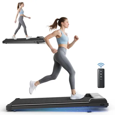 A woman is running on a treadmill, and another woman is walking on a treadmill in the background. A remote control is also visible.