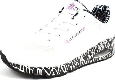 A single white sneaker with black and white patterned sole and interior lining.