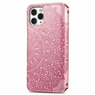 A pink phone case with a mandala pattern embossed on it.