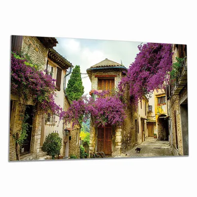 Produktbild von Wallario Herdabdeckplatte aus Glas, Größe 90 x 52 cm 1-teilig, Motiv Malerische Stadt in der Provence mit bunten Blumen