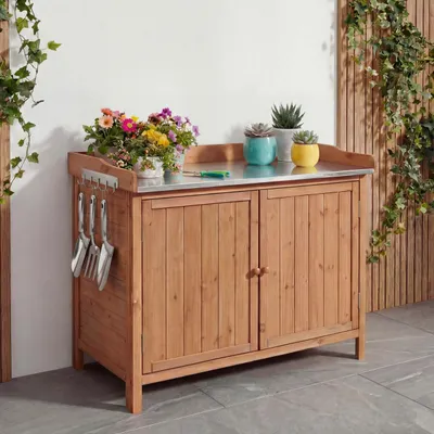 Immagine prodotto di Mobile da giardino con piano di lavoro HWC-L69, tavolo per piante, legno di abete da esterno ® 86x104x52cm ~ marrone