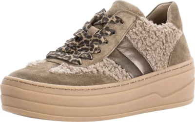 A studio shot of a single women's sneaker.