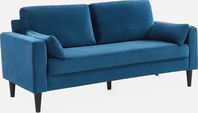 A blue velvet sofa with wooden legs, shown from a slight angle against a white background.