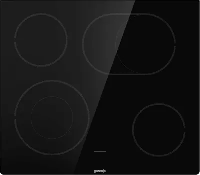 A top-down view of a black induction cooktop with four heating elements. The cooktop has a reflective surface, showing a diagonal glare across the top right.