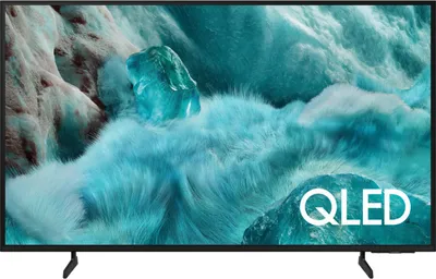A Samsung QLED television displaying a vibrant, abstract image.