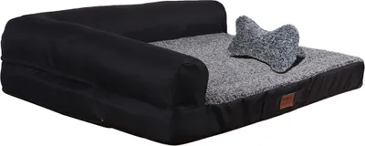 A dog bed with a bone-shaped pillow on a white background.