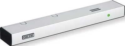 A product shot of a silver rectangular device with black ends and a green indicator light.