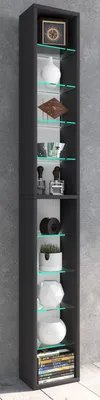 A tall, narrow black shelving unit with glass shelves, displaying various decorative items and books.
