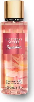 A Victoria's Secret Temptation body mist bottle.