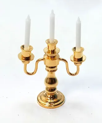 Produktbild von Miniatur Kerzenhalter aus Metall weiße Kerze. Messingfarbig, für 1:12 Puppenhaus