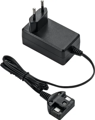 A black power adapter with a European plug on one end and a UK plug on the other, connected by a black cable.